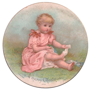 Little girl in pink on a circular Christmas card