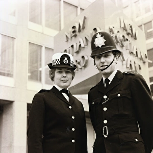 Male and female police officers on duty in London