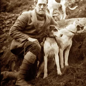 man with foxhounds