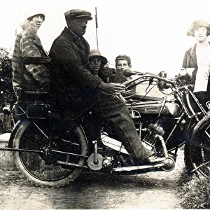 Man sitting on a 1921 / 22 Blackburne motorcycle & sidecar