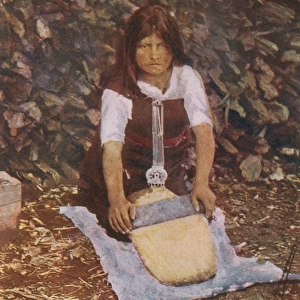 Mapuche Girl grinding toasted wheat - Southern Chile