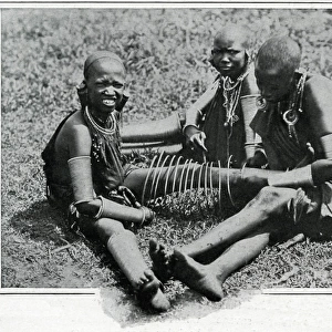 Masai young women adjusting iron wire