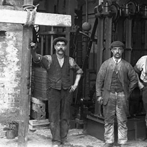 Four men in hat factory finishing room