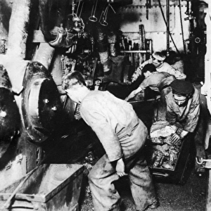 Men at work in engine room of a ship, WW1
