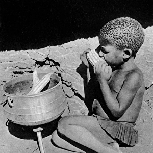 Native African Matabele boy eating