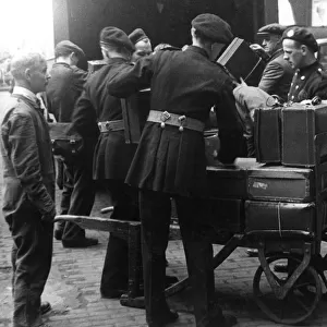 NFS personnel loading luggage, St Pancras, WW2
