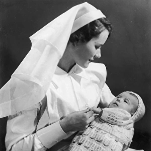 Nurse holding baby