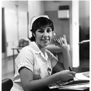 Nurse seated at desk