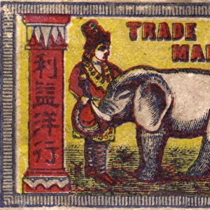 Old Japanese Matchbox label with a man with an elephant