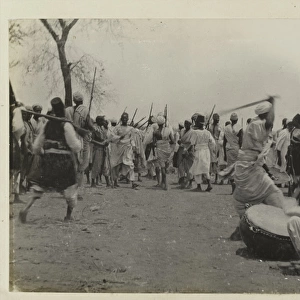 Photograph of Sudanese preparing for battle