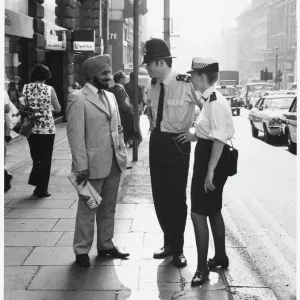 Metropolitan Police Print: Officers Engage with Asian Man Metropolitan Police Print: Officers Engage with Asian Man