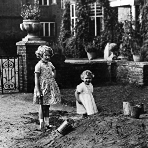 Princess Elizabeth and Princess Margaret digging