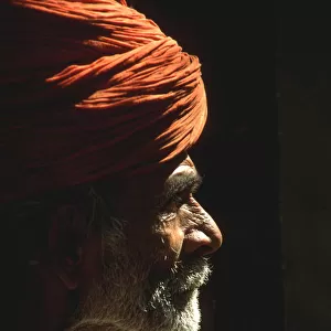 Profile portrait of beared Indian man