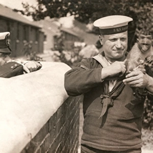 Sailor of HMS Ganges with monkey mascot, WW1