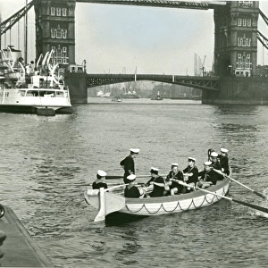 Sea Scouts in a whaler near Tower Bridge, London