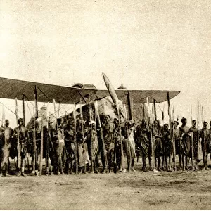 Shulluks pose by Cobhams aeroplane, Malakal, Sudan