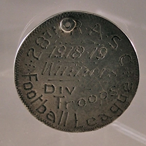 Silver medal engraved with two War Department arrows