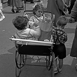 Small children and pram, Whitechapel Market, London
