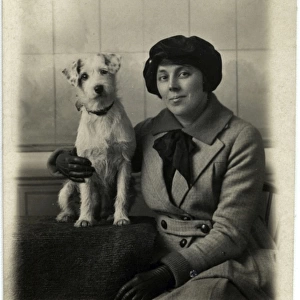 Studio portrait, woman with terrier dog