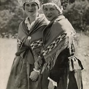Two Swiss girls wearing traditional Zurich peasant costumes including shawls