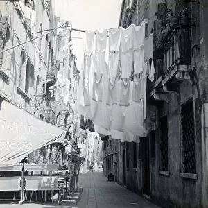 Washing hanging between houses, Verona, Italy