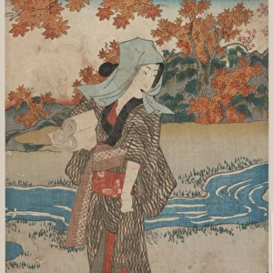 A woman beneath maple leaves