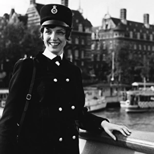 Woman police officer on a bridge, London