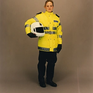 Woman police officer in reflective uniform, London