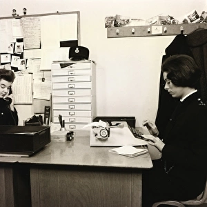 Woman police officer working in a police station