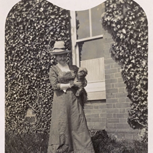 Woman with Terrier in a garden