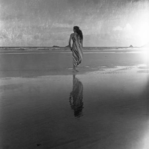 Woman on a twilight beach