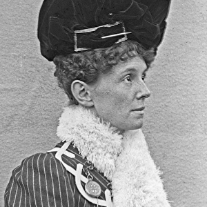 Woman wearing a tall black hat
