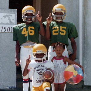 Young black American children in football outfits