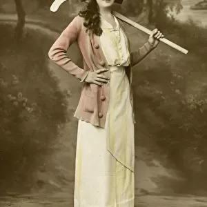 Youthful British Beauty holding her hockey stick