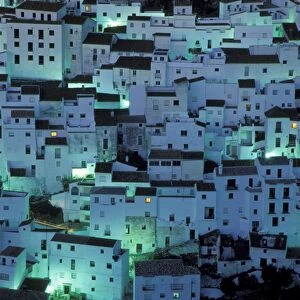 Spain - The brilliant "White Town" of Casares, spectacularly clinging to a steep hillside; at dawn. Province of Malaga, Andalucia, Spain