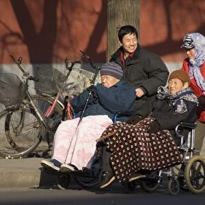 Elderly Chinese in wheelchairs
