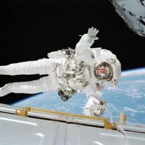 Astronaut Rex J Walheim in space suit during ISS construction space walk Astronaut Rex J Walheim in space suit during ISS construction space walk
