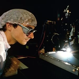 Technician supervising solar cell manufacture