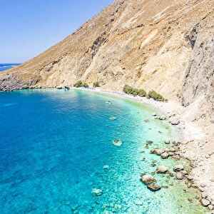 Aerial view of the scenic Glyka Nera beach by the crystal turquoise sea, Hora Sfakion, Crete island, Greek Islands, Greece, Europe