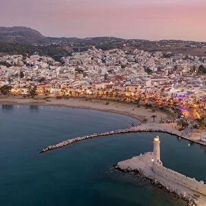 Aerial view of Venetian harbour and lighthouse at sunset, Rethymno, Crete island, Greek Islands, Greece, Europe