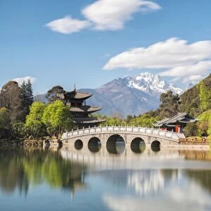 Black Dragon Pool with Moon Embracing Pagoda and Suocui Bridge in Jade Spring Park of Lijiang, Yunnan, China, Asia