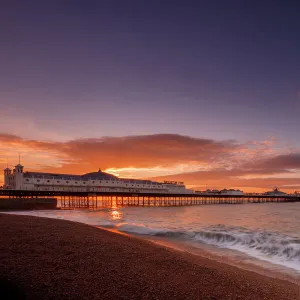 Brighton Pier and beach at sunrise, Brighton, East Sussex, Sussex, England, United Kingdom