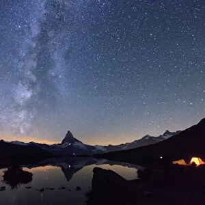 Camping under the stars and Milky Way with Matterhorn reflected in Lake Stellisee