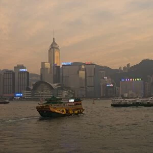 A Chinese style tourist boat sails in Victoria Harbour, Hong Kong, China, Asia