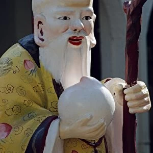 Close-up of a statue of an old Chinese Confucian sage
