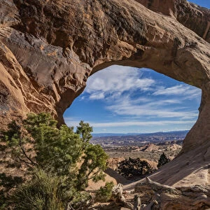 Desert landscape viewed through Partition Arch, Arches National Park, Utah