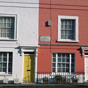 Exterior facade of colourful terraced houses, Chelsea, London, England