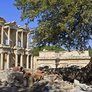 Facade of the Library of Celsus, fruit tree and ancient pipes, ancient Ephesus, near Kusadasi, Anatolia, Turkey, Asia Minor, Eurasia