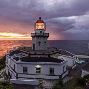 Farol do Arnel lighthouse at sunrise in a cloudy morning, Sao Miguel island, Azores, Portugal, Atlantic, Europe