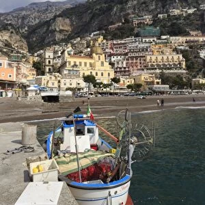 Fishing boat at quayside and Positano town, Costiera Amalfitana (Amalfi Coast), UNESCO